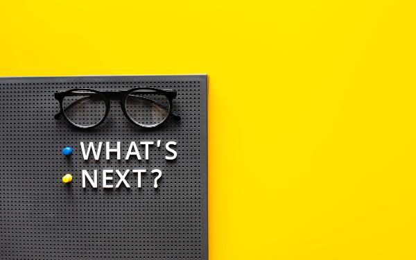 What's next ? text with glasses on work table.trends research and new things.business startup concepts